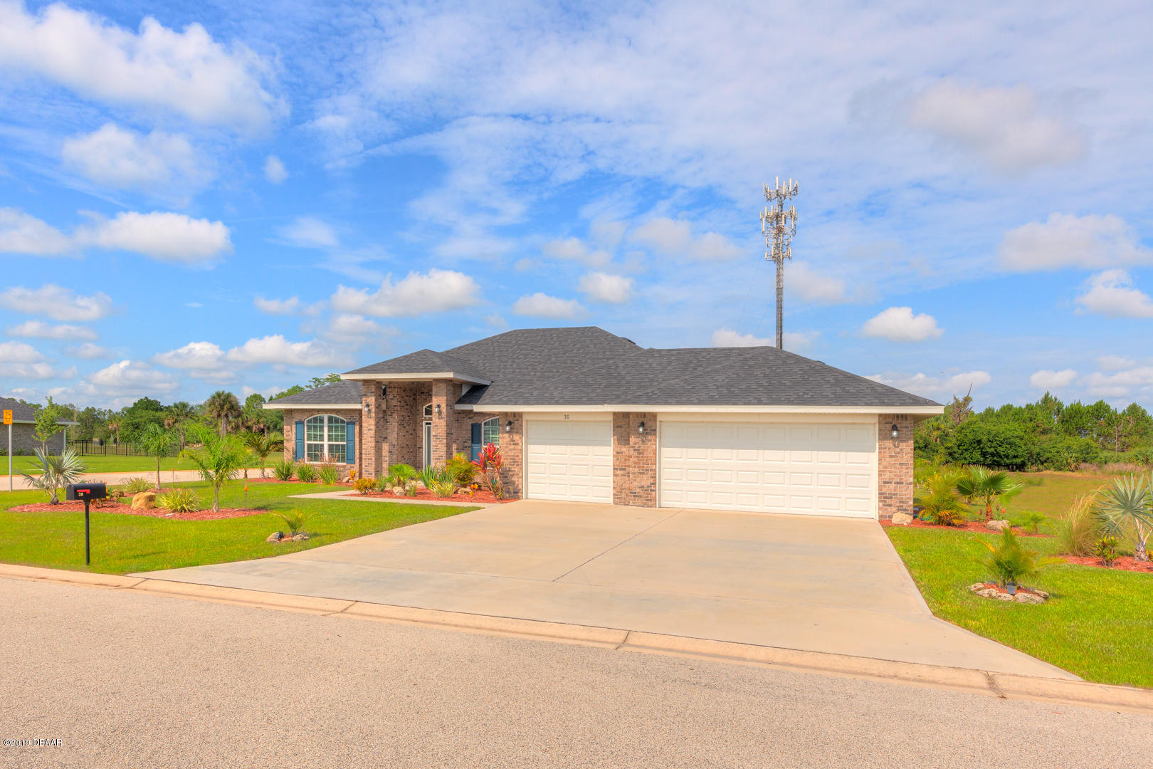 30 Turtle Ridge Drive Flagler Beach, FL 32136 - Photo 34 of 34 a front view of a house with a yard and table and chairs