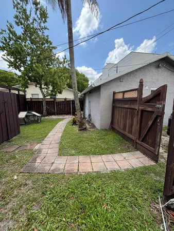 a view of a backyard with a tub