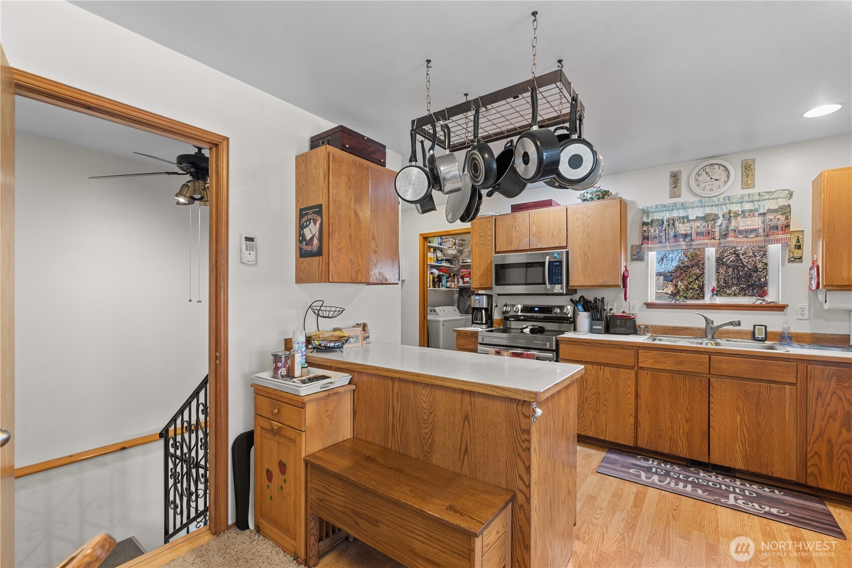3152 Bermuda Street Malaga, WA 98828 - Photo 13 of 37 a kitchen with a sink cabinets and window