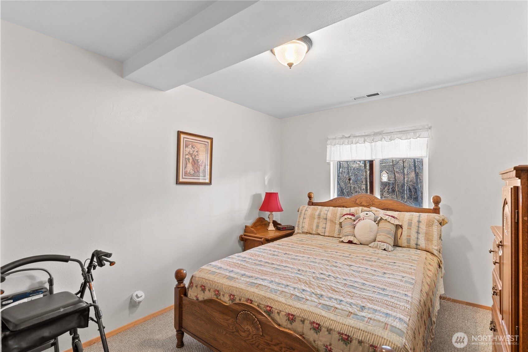 3152 Bermuda Street Malaga, WA 98828 - Photo 29 of 37 a bedroom with a bed and wooden floor