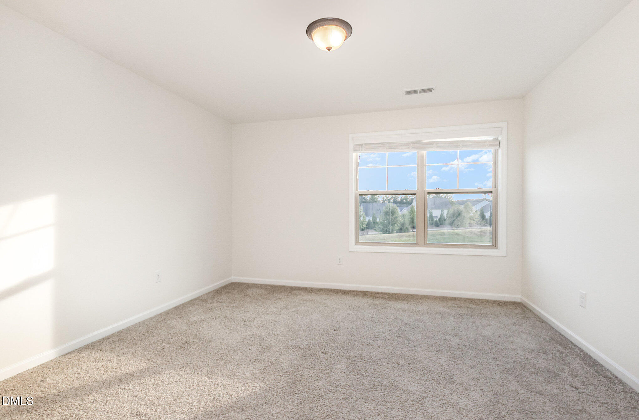 824 Country Downs Road Wake Forest, NC 27587 - Photo 24 of 43 an empty room with windows