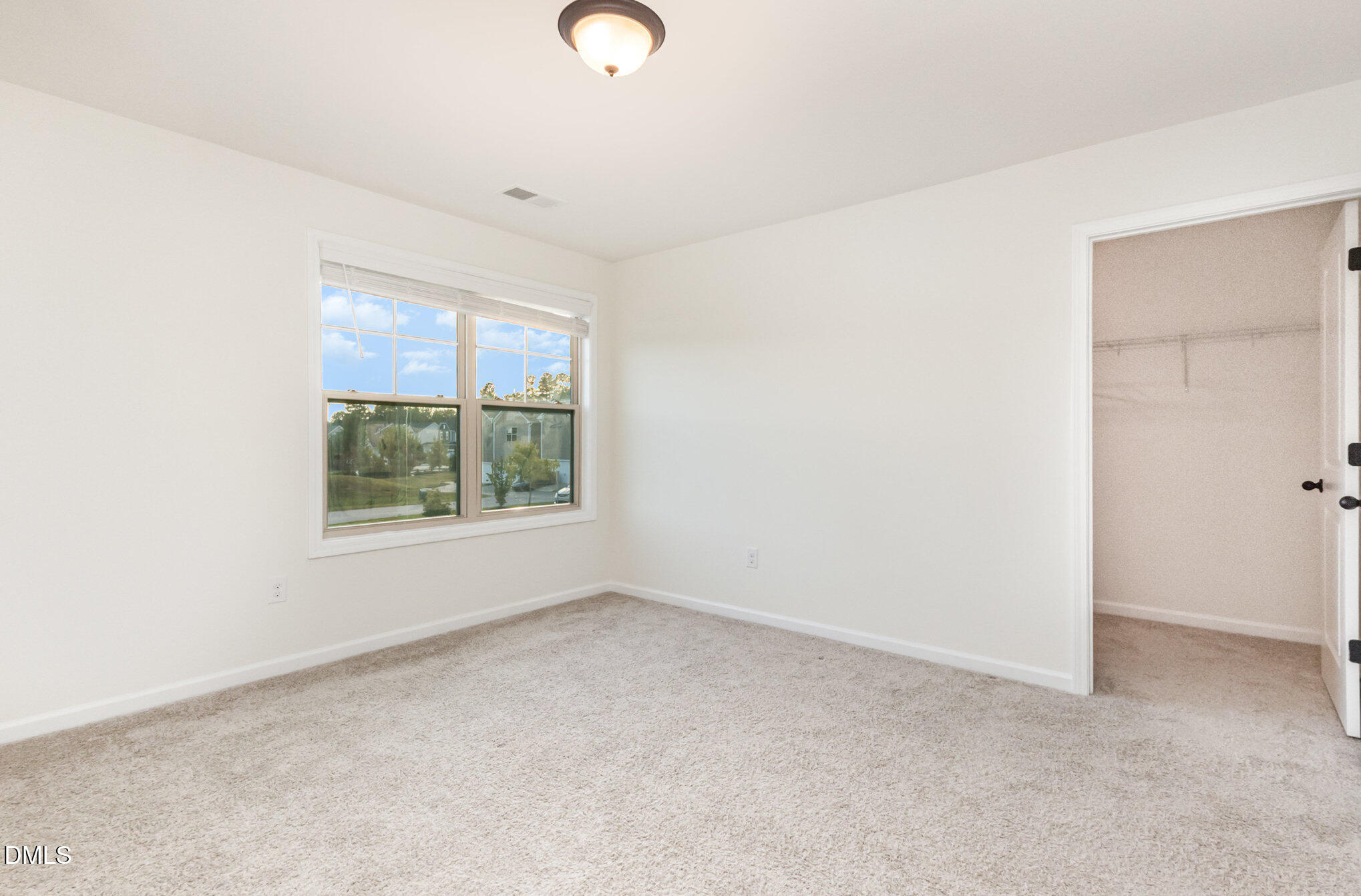 824 Country Downs Road Wake Forest, NC 27587 - Photo 25 of 43 an empty room with windows