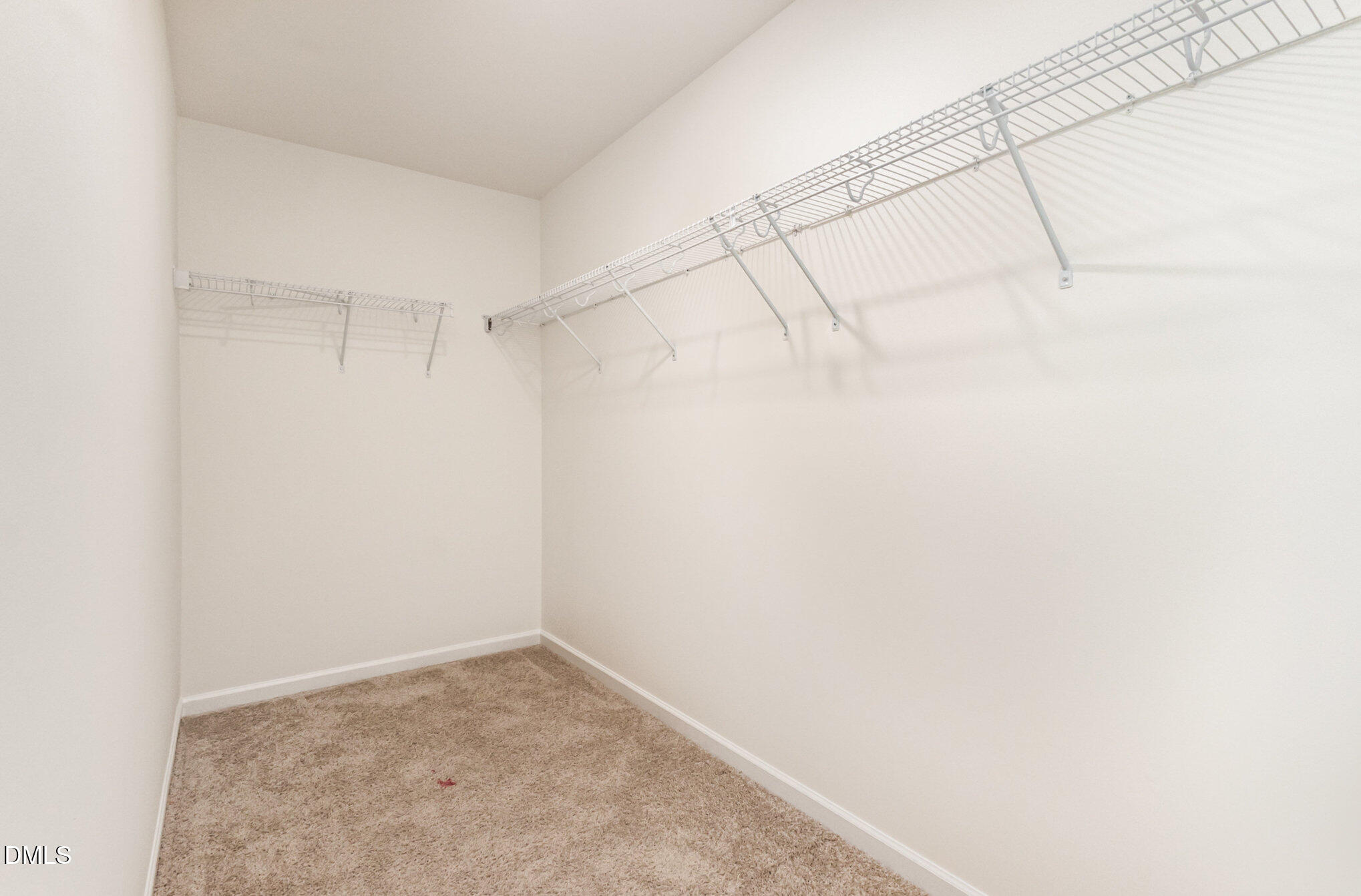 824 Country Downs Road Wake Forest, NC 27587 - Photo 27 of 43 a view of a room with racks on the wall