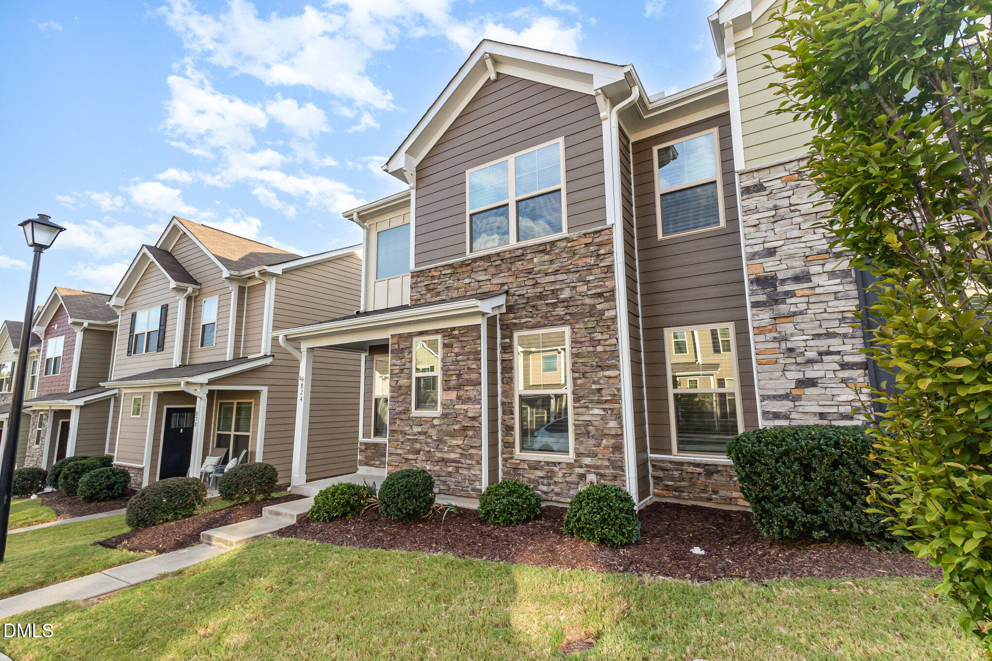 824 Country Downs Road Wake Forest, NC 27587 - Photo 2 of 43 a front view of a house with garden