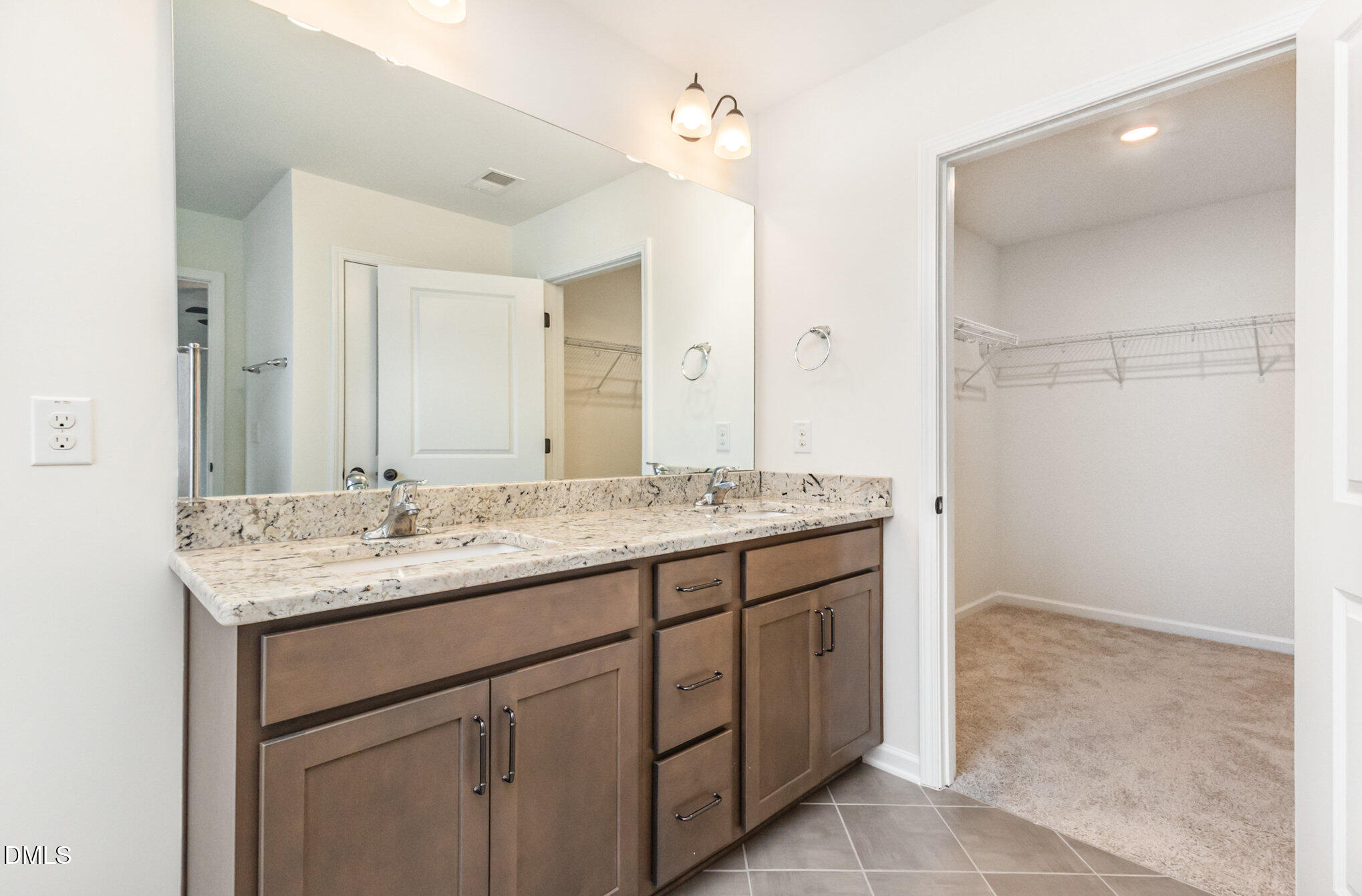 824 Country Downs Road Wake Forest, NC 27587 - Photo 33 of 43 a bathroom with a granite countertop sink and a mirror