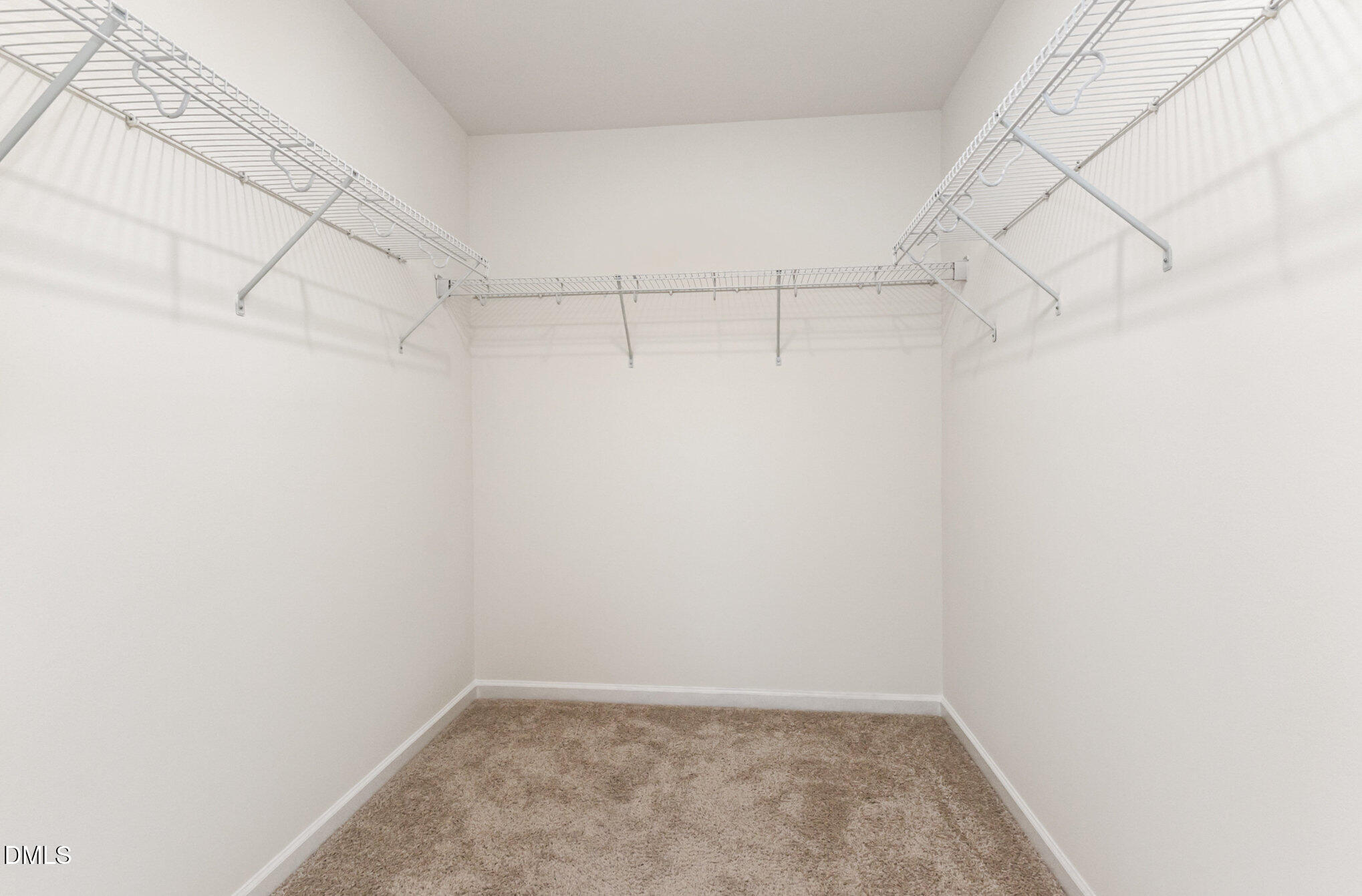 824 Country Downs Road Wake Forest, NC 27587 - Photo 35 of 43 a view of a room with racks on the wall