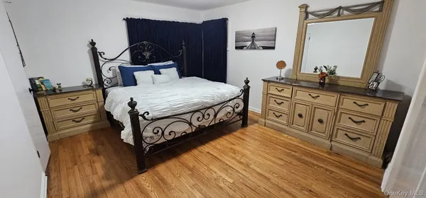 a bedroom with a bed and a walk in closet