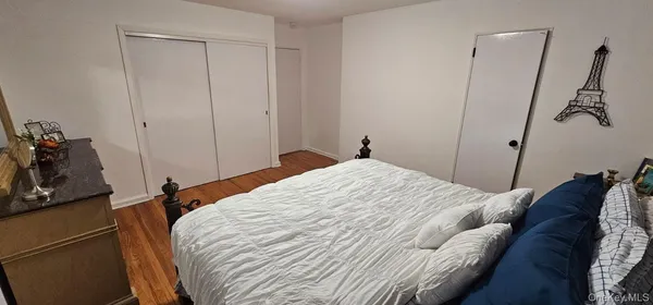 a bed room with a bed and a television