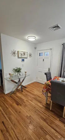 a kitchen with cabinets stainless steel appliances a sink and a window