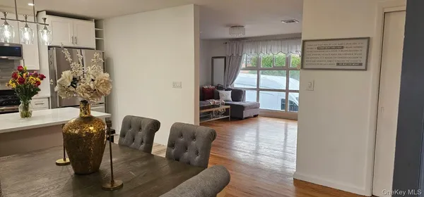 a living room with furniture and large window
