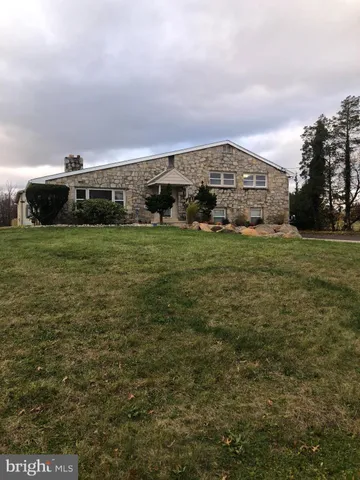 a view of houses with outdoor space and garden
