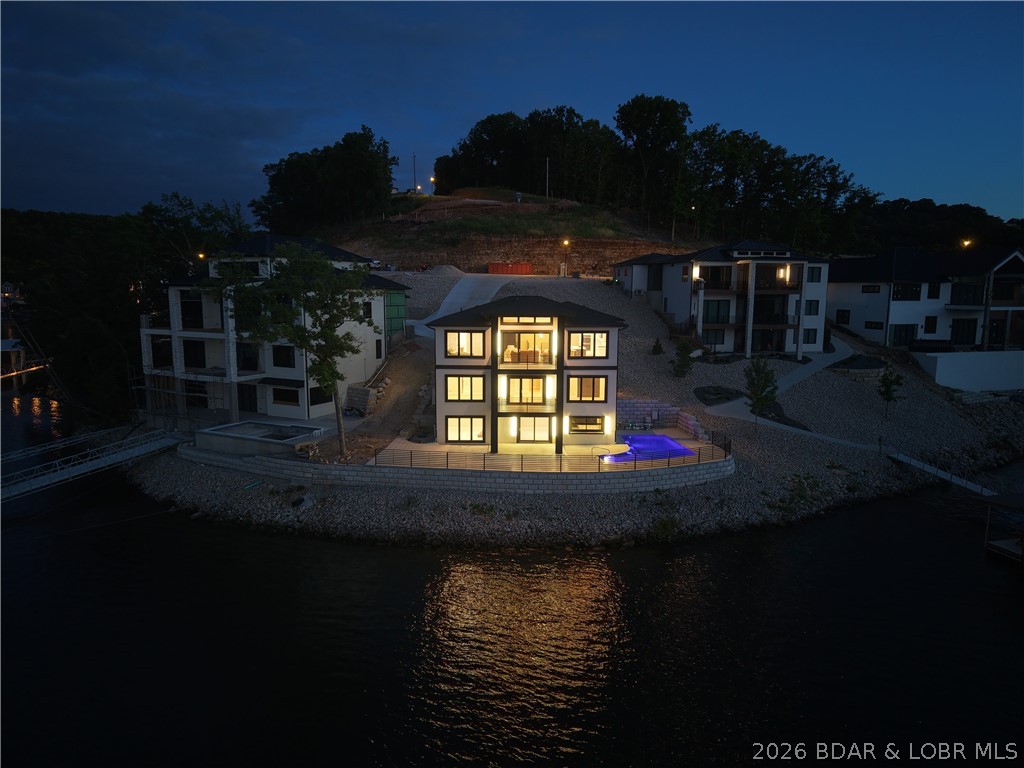 439 Red Bud Road Lake Ozark, MO 65049 - Photo 84 of 98 Evening waterfront view showcasing the resort-like