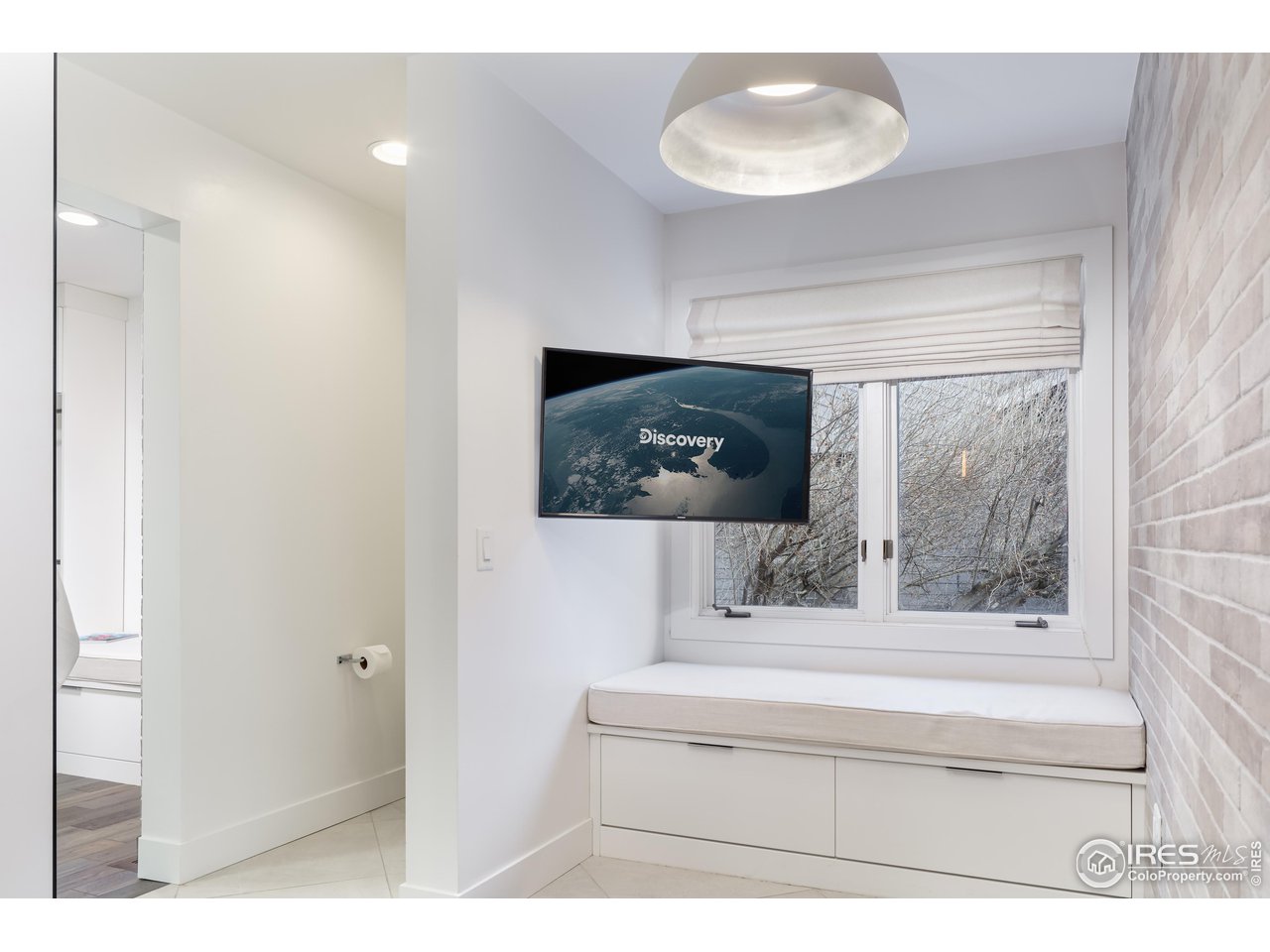 5315 Centennial Trail Boulder, CO 80303 - Photo 16 of 40 Primary suite built-in vanity #1 seating in the bathroom; all tv's convey. Custom blinds throughout the home.