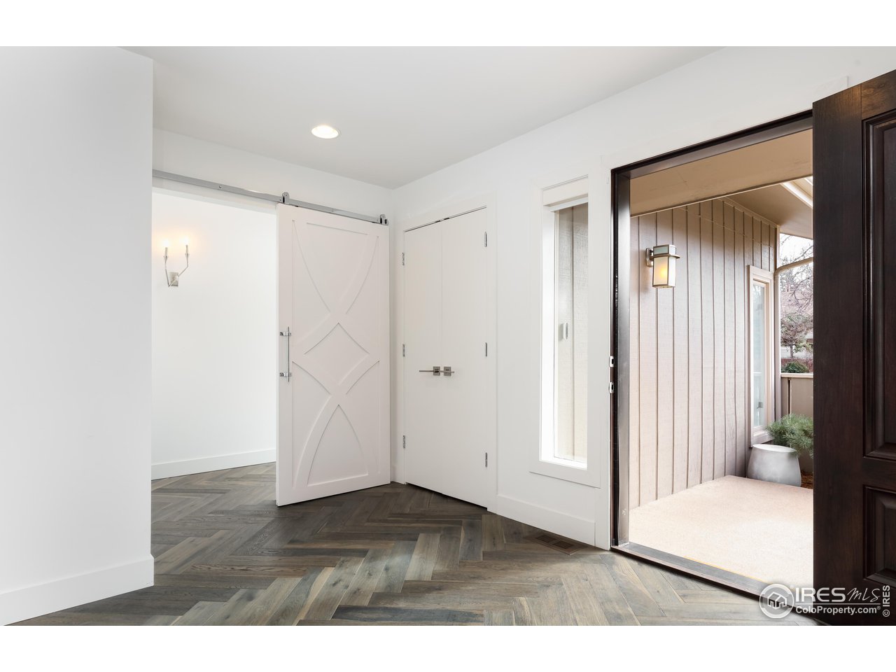 5315 Centennial Trail Boulder, CO 80303 - Photo 33 of 40 Front door porch entry, closet and primary suite entry