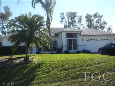 9024 Frank Road Fort Myers, FL 33967 - Photo 1 of 10 a view of a house with backyard and trees