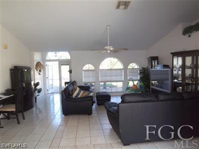 9024 Frank Road Fort Myers, FL 33967 - Photo 7 of 10 a living room with furniture and a flat screen tv
