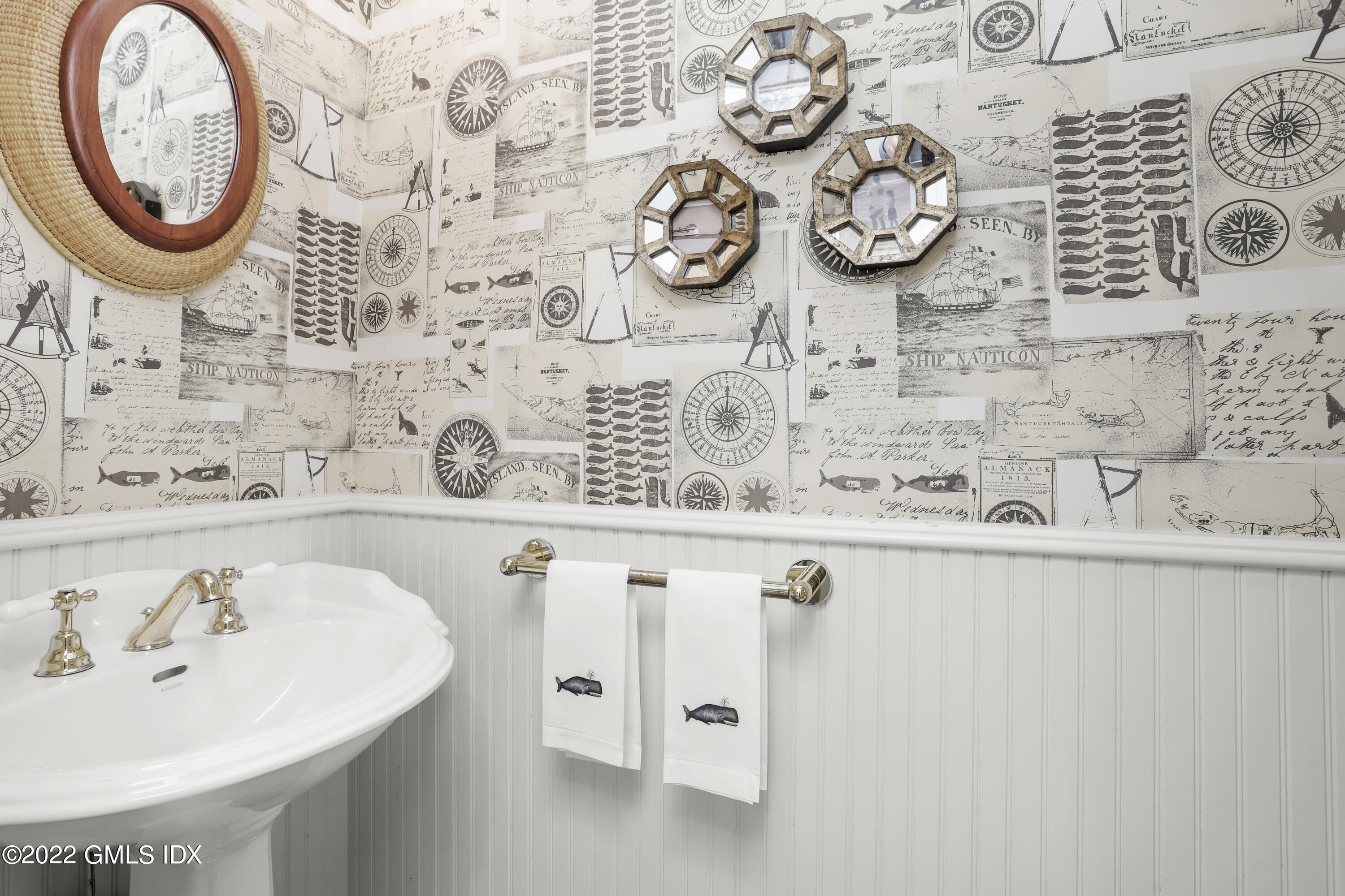 65 Doubling Road Greenwich, CT 06830 - Photo 15 of 33 a bathroom with a sink and a mirror