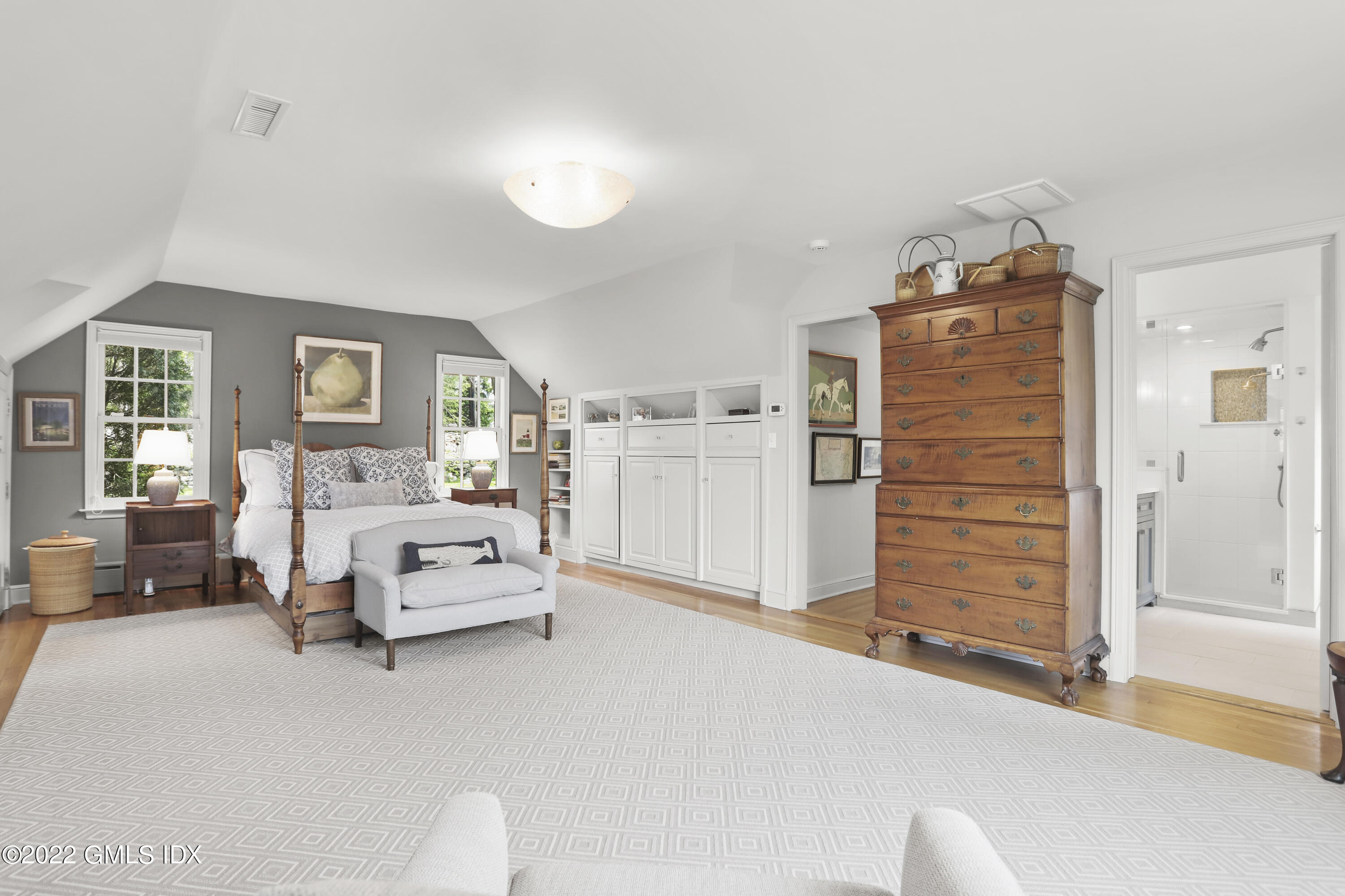 65 Doubling Road Greenwich, CT 06830 - Photo 17 of 33 a spacious bedroom with a bed and dresser