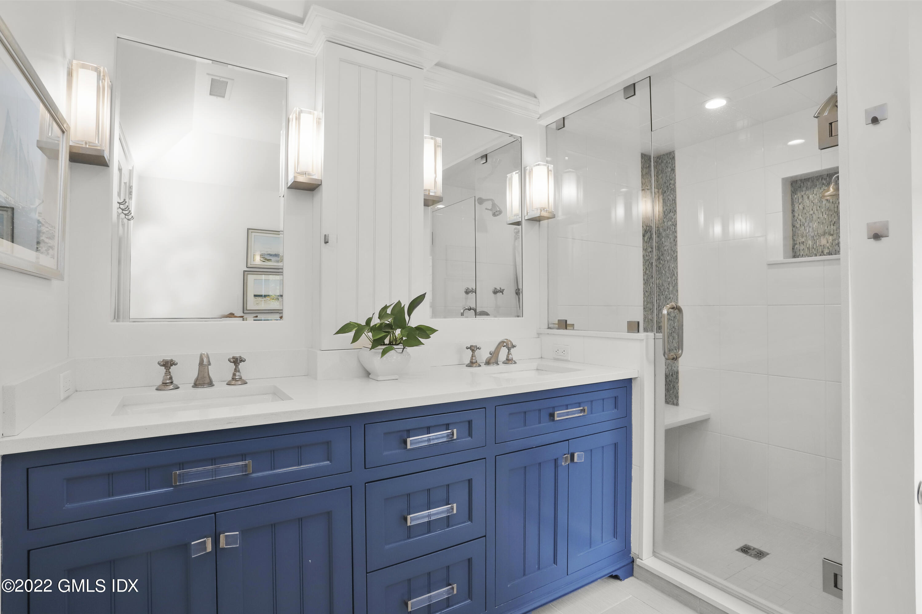 65 Doubling Road Greenwich, CT 06830 - Photo 18 of 33 a bathroom with a sink and a mirror