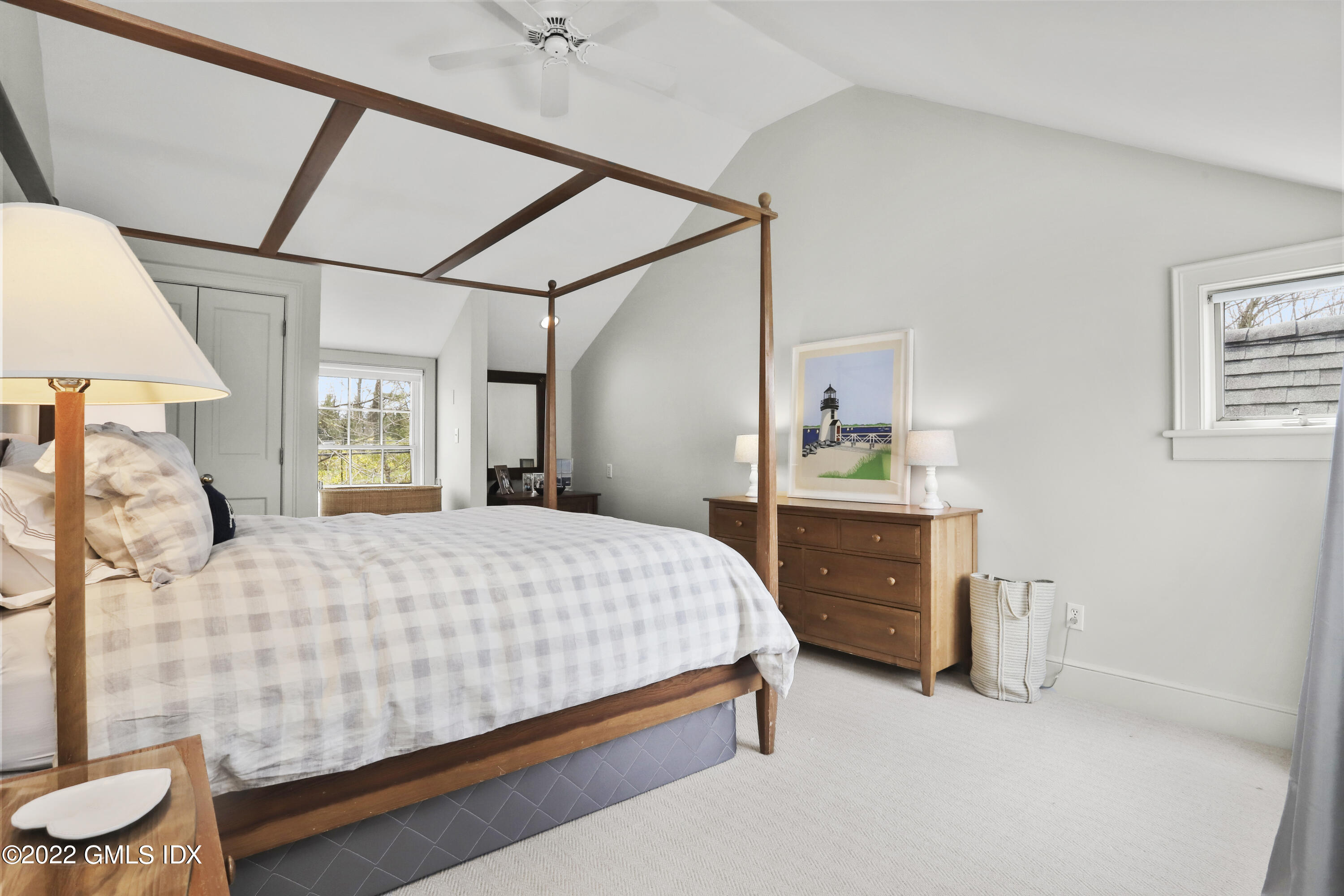 65 Doubling Road Greenwich, CT 06830 - Photo 20 of 33 a bedroom with a bed and a dresser with closet