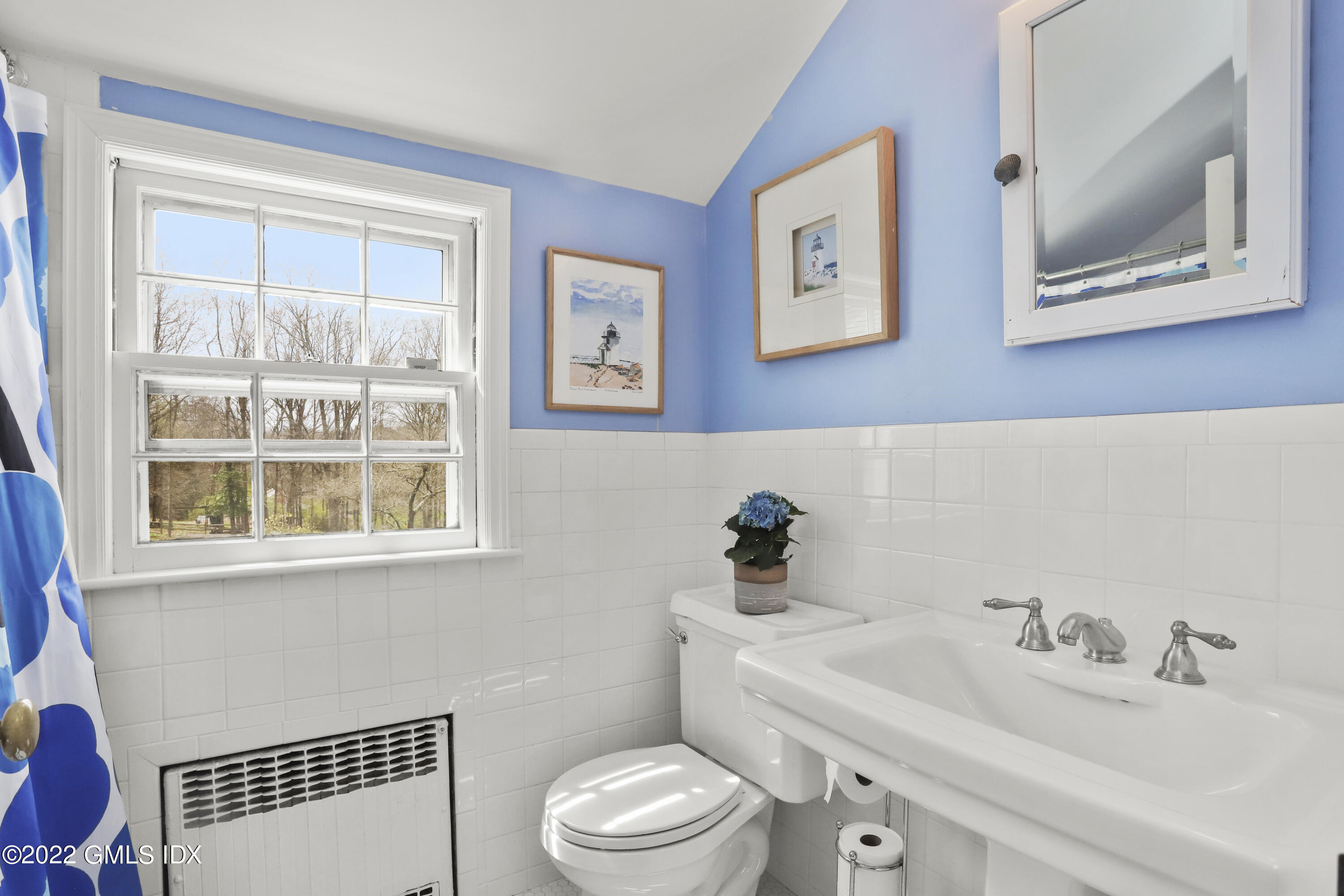 65 Doubling Road Greenwich, CT 06830 - Photo 23 of 33 a white toilet sitting next to a bathroom sink