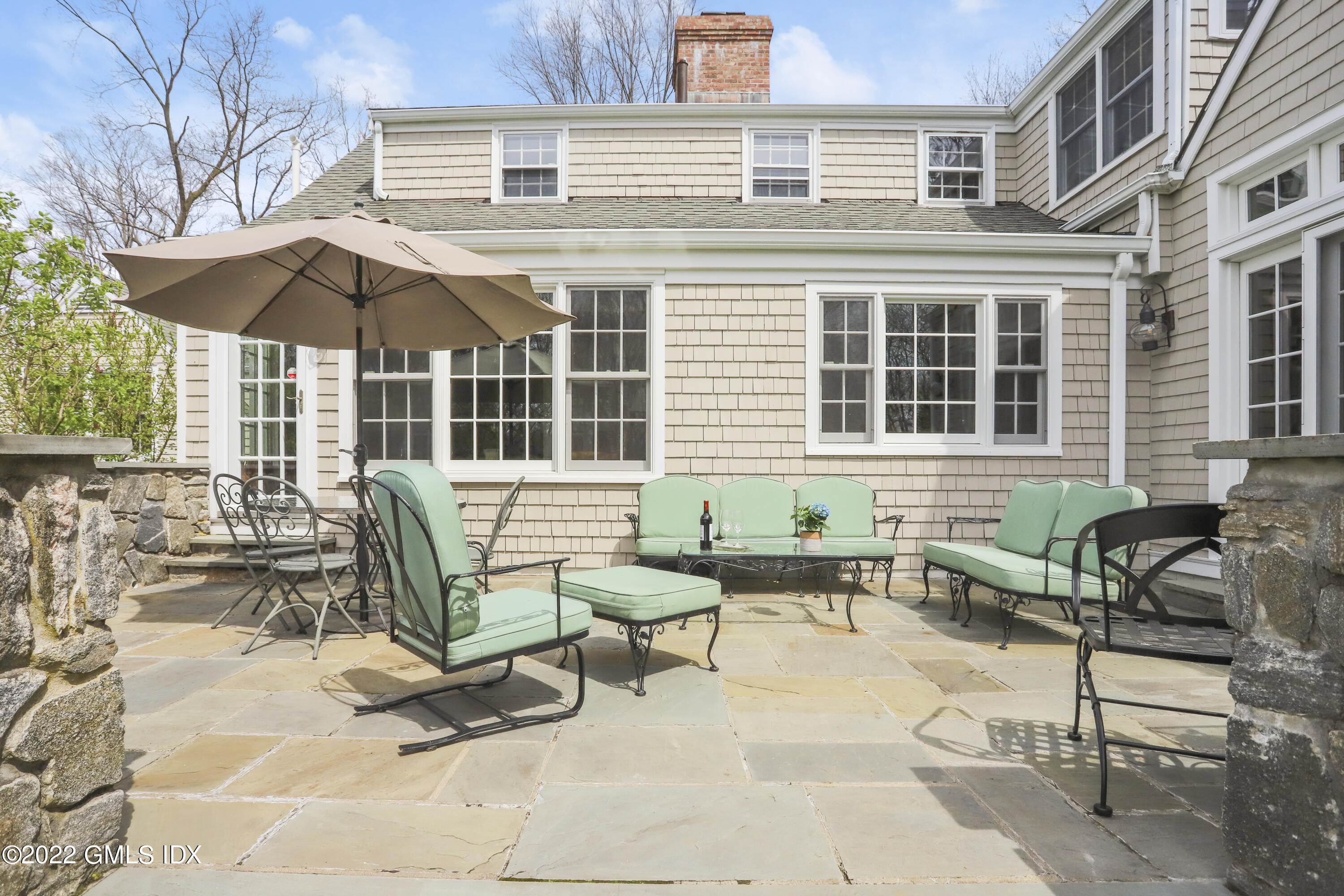 65 Doubling Road Greenwich, CT 06830 - Photo 26 of 33 a view of a house with backyard and sitting area