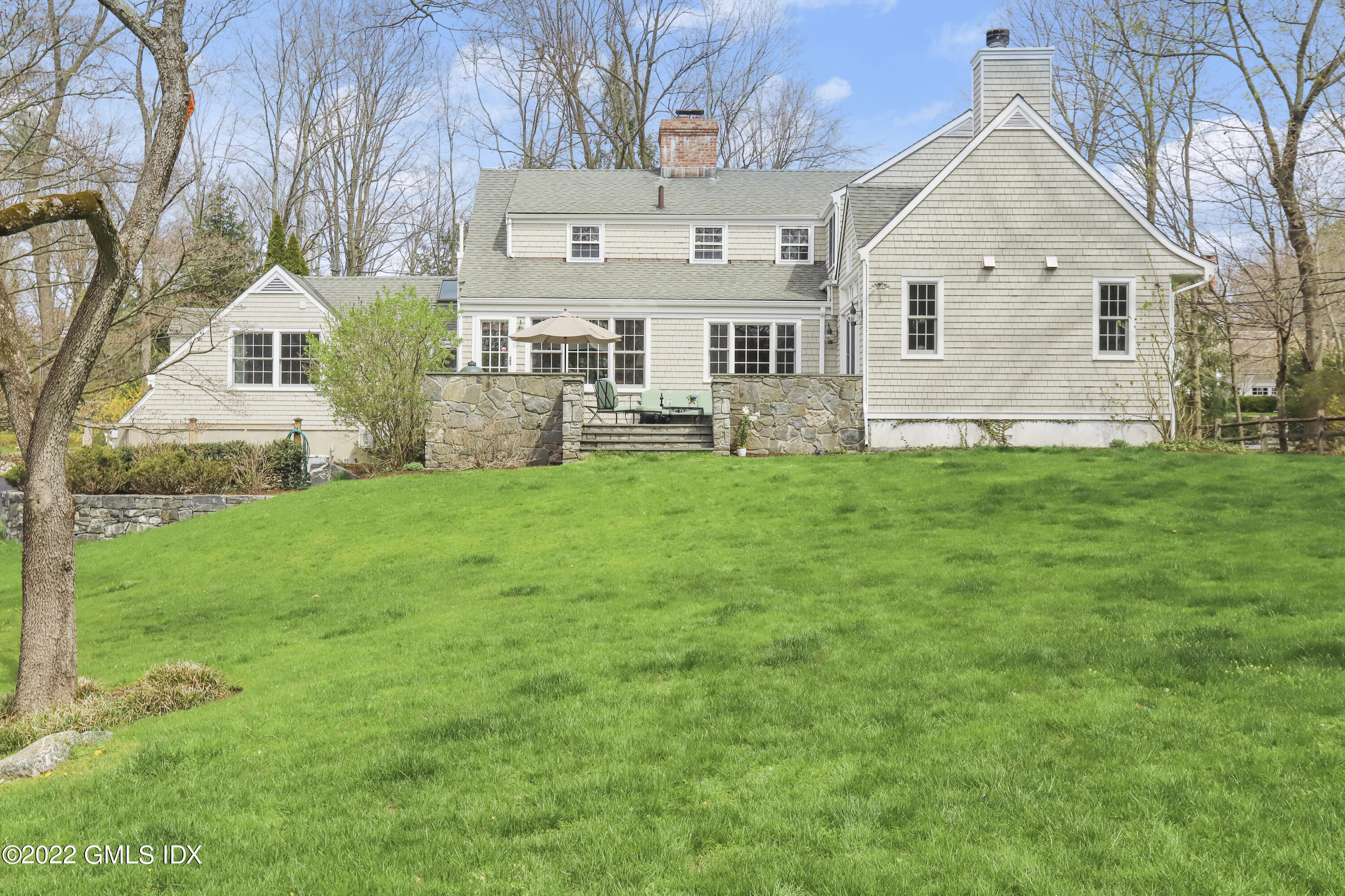 65 Doubling Road Greenwich, CT 06830 - Photo 28 of 33 a view of a house with a yard