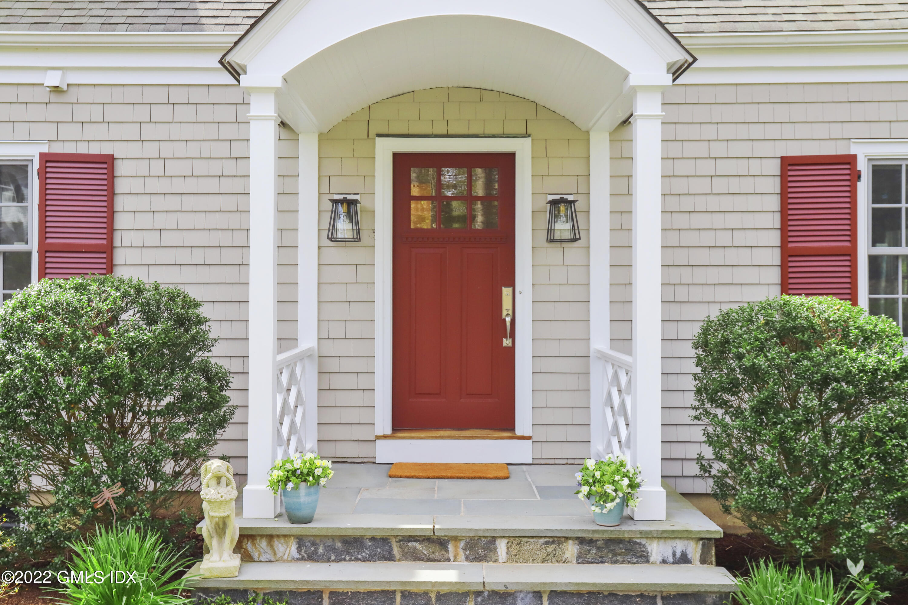 65 Doubling Road Greenwich, CT 06830 - Photo 33 of 33 a front view of a house with a garden