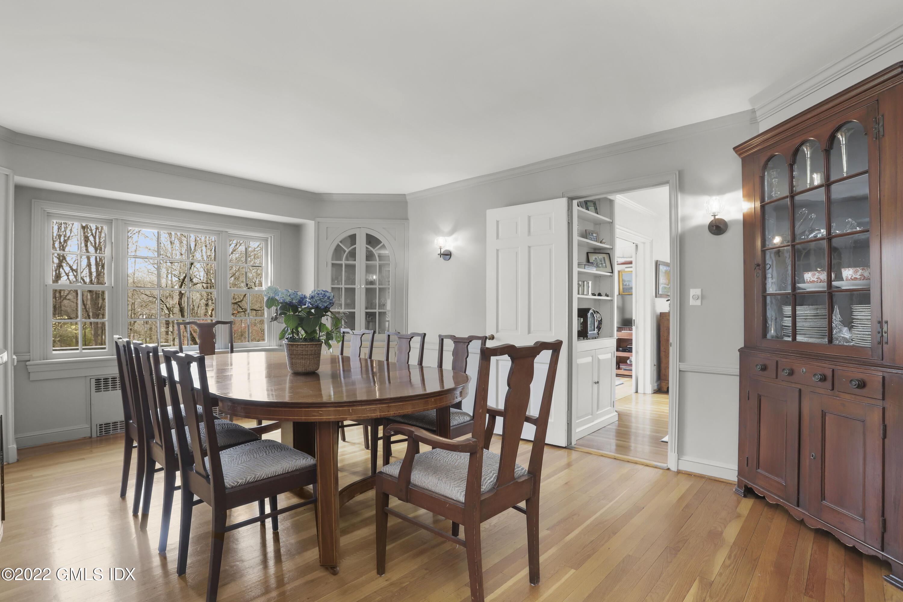 65 Doubling Road Greenwich, CT 06830 - Photo 4 of 33 a view of a dining room with furniture and wooden floor
