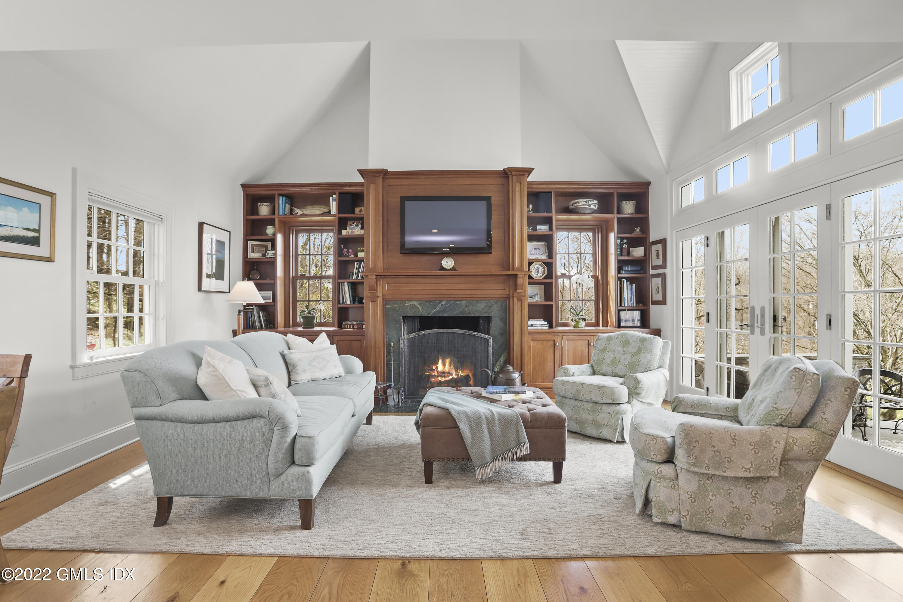 65 Doubling Road Greenwich, CT 06830 - Photo 8 of 33 a living room with furniture and a fireplace