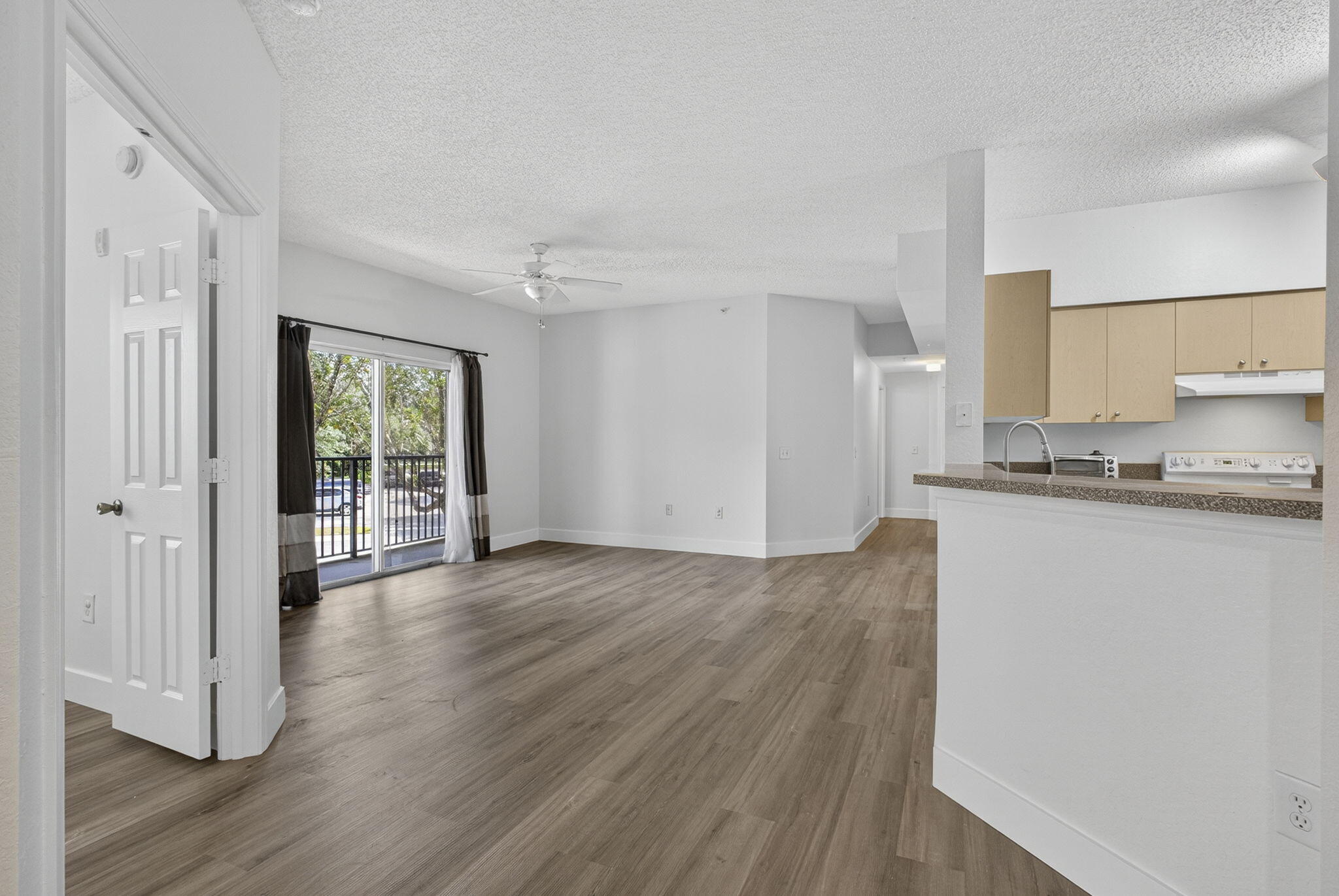 340 Crestwood Circle, Unit 201 Royal Palm Beach, FL 33411 - Photo 11 of 41 a view of a kitchen with wooden floor and a window