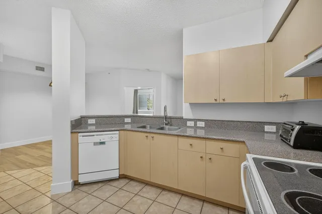 a kitchen with a sink and cabinets