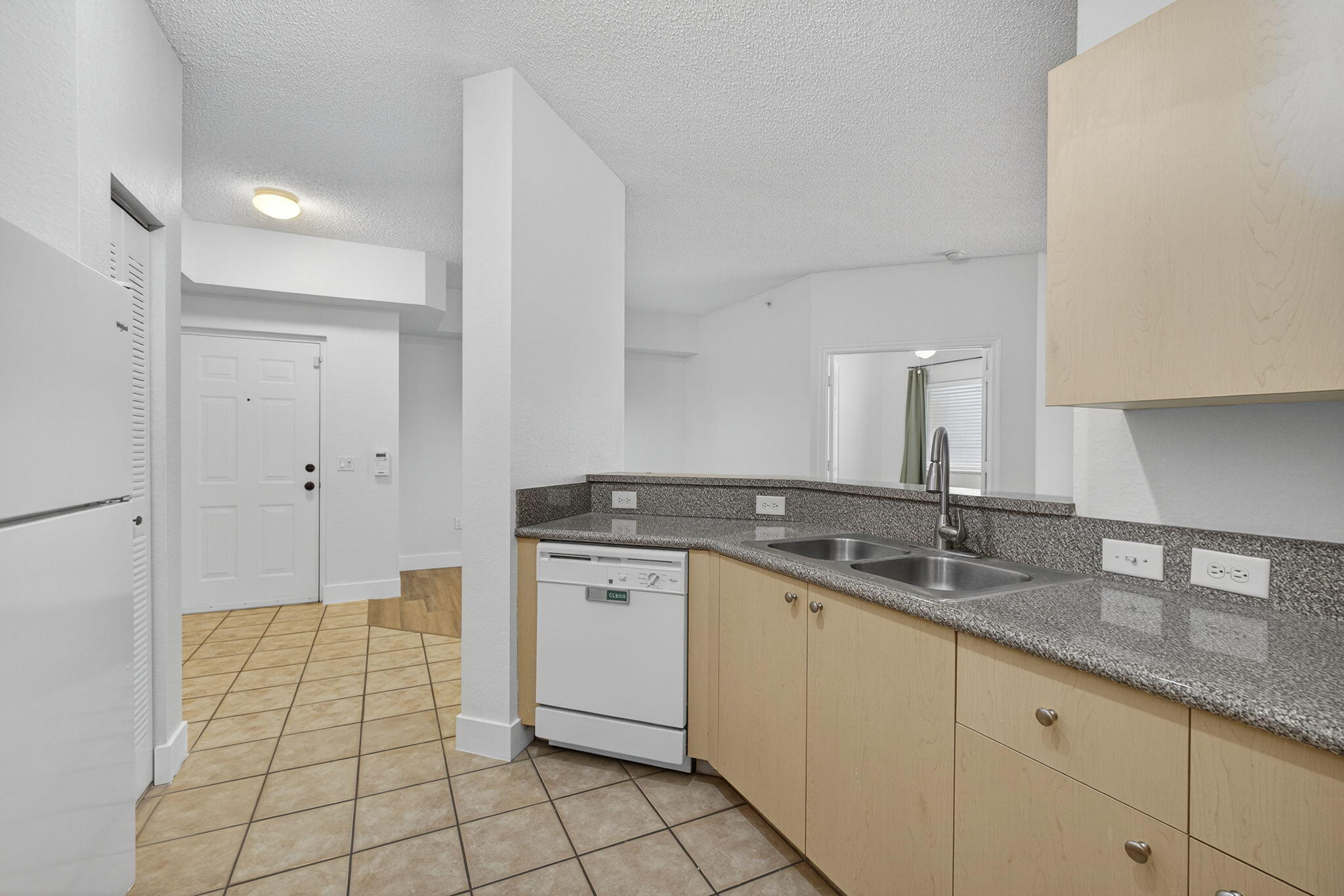 340 Crestwood Circle, Unit 201 Royal Palm Beach, FL 33411 - Photo 21 of 41 a kitchen with a sink and cabinets