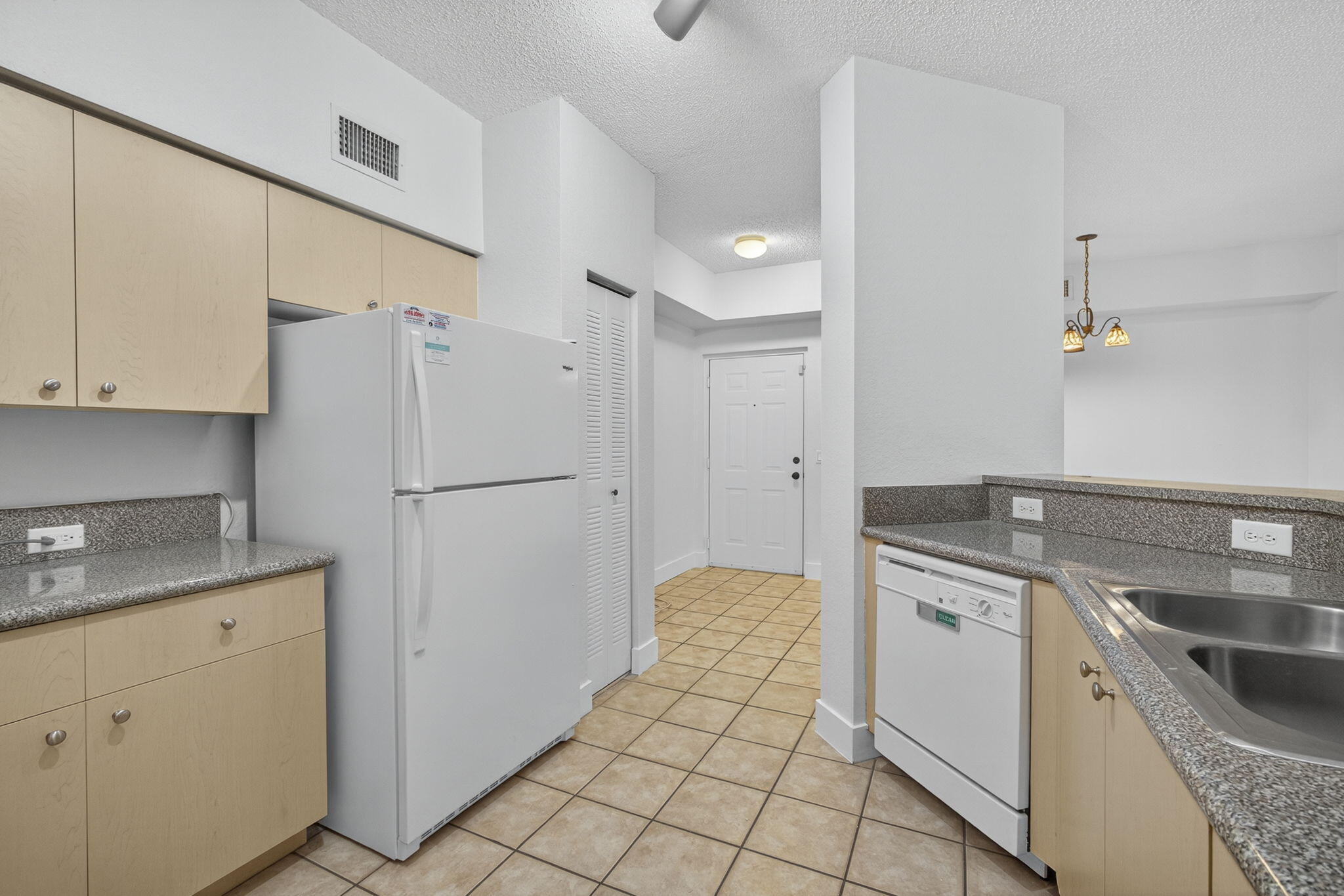 340 Crestwood Circle, Unit 201 Royal Palm Beach, FL 33411 - Photo 23 of 41 a kitchen with a stove a refrigerator and a sink