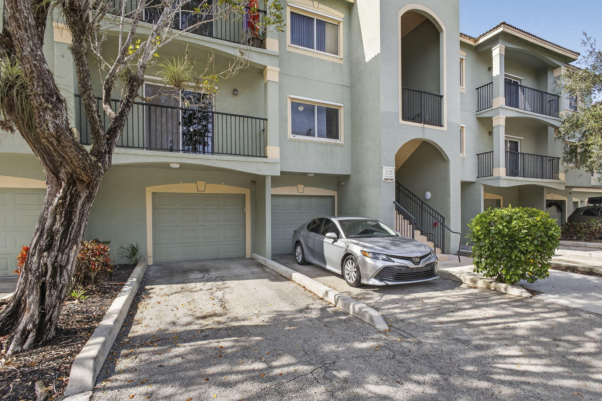 340 Crestwood Circle, Unit 201 Royal Palm Beach, FL 33411 - Photo 3 of 41 a front view of a house with parking space