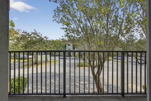 a view of a balcony with wooden floor