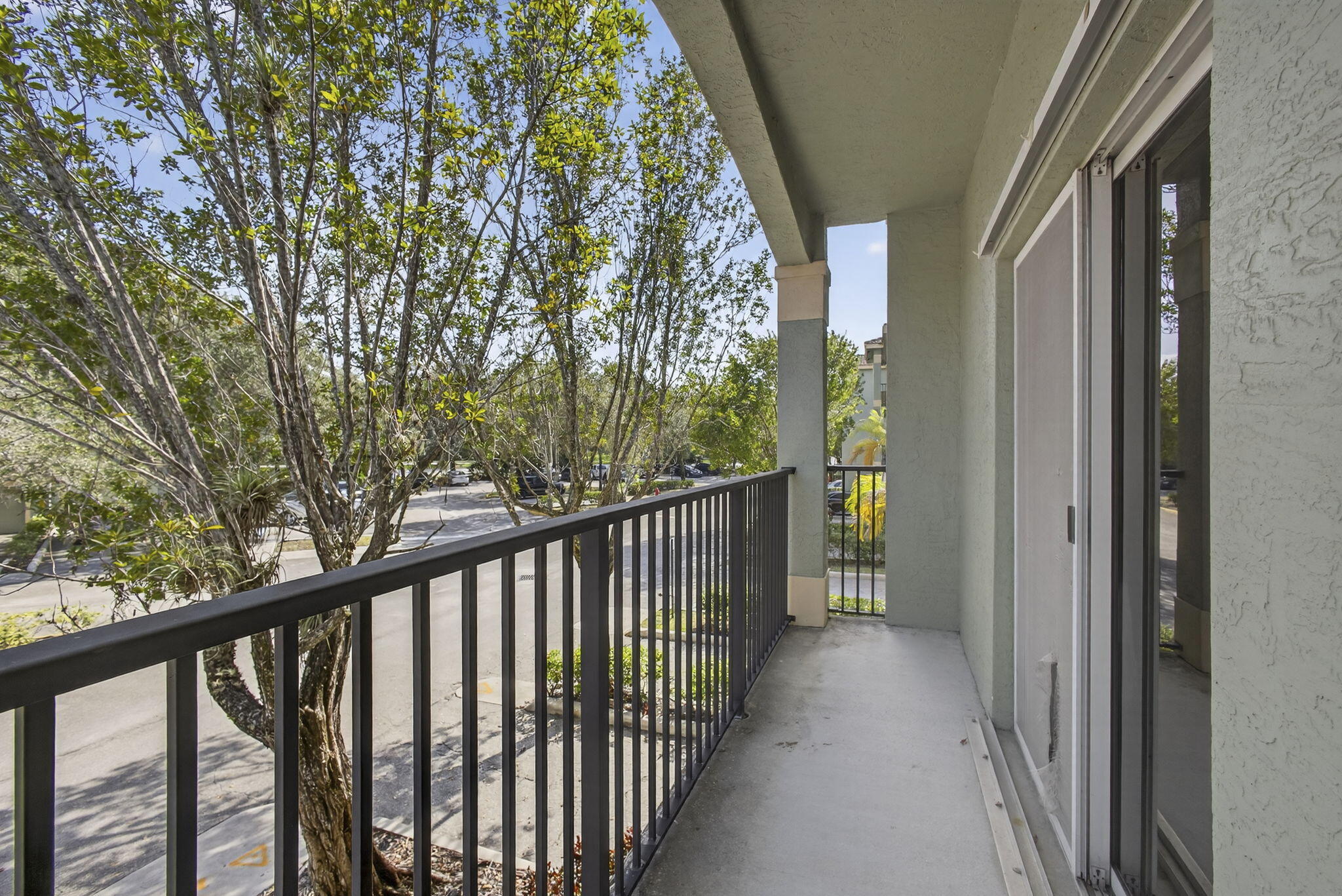 340 Crestwood Circle, Unit 201 Royal Palm Beach, FL 33411 - Photo 40 of 41 a view of a balcony with wooden floor