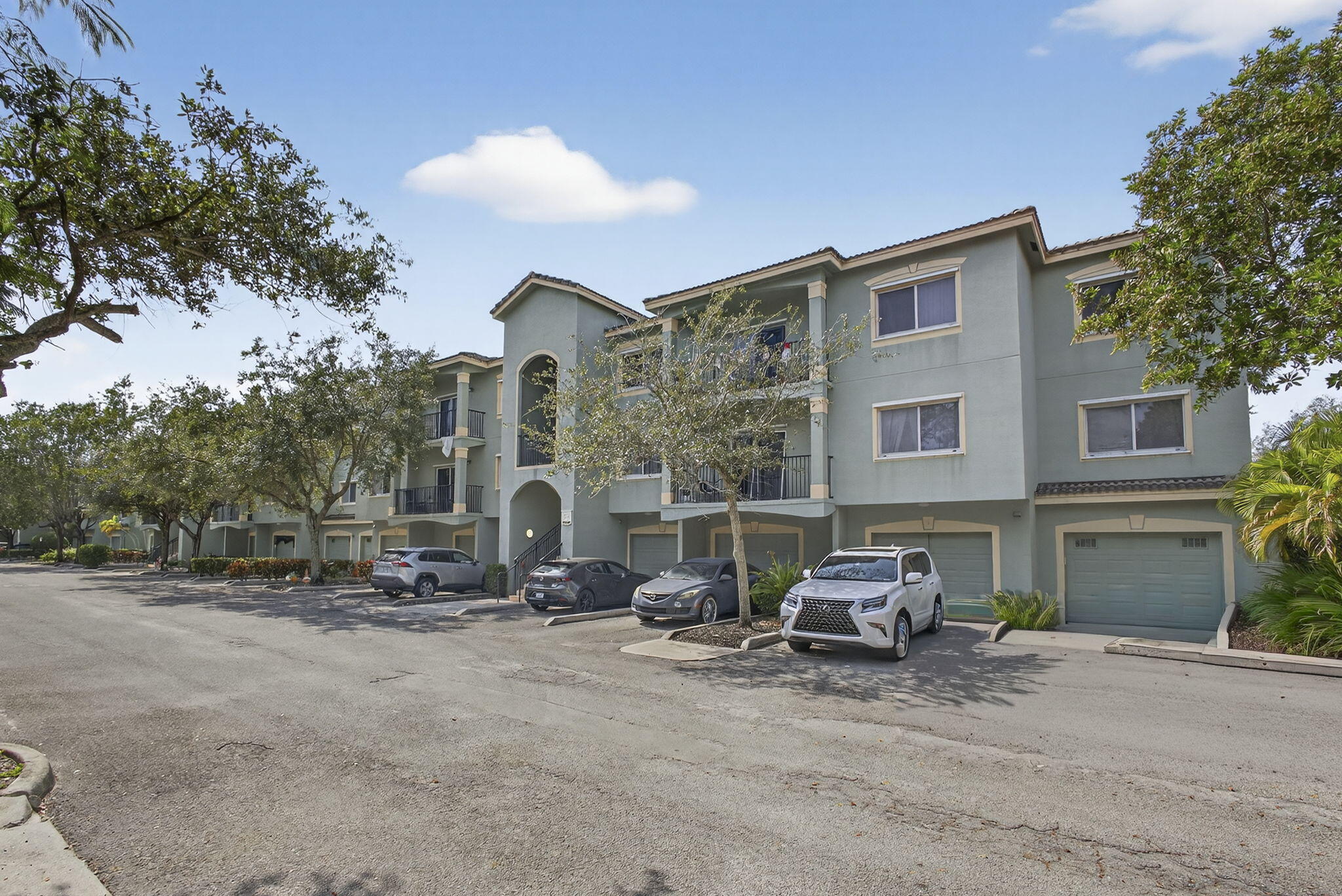 340 Crestwood Circle, Unit 201 Royal Palm Beach, FL 33411 - Photo 4 of 41 a car parked in front of house