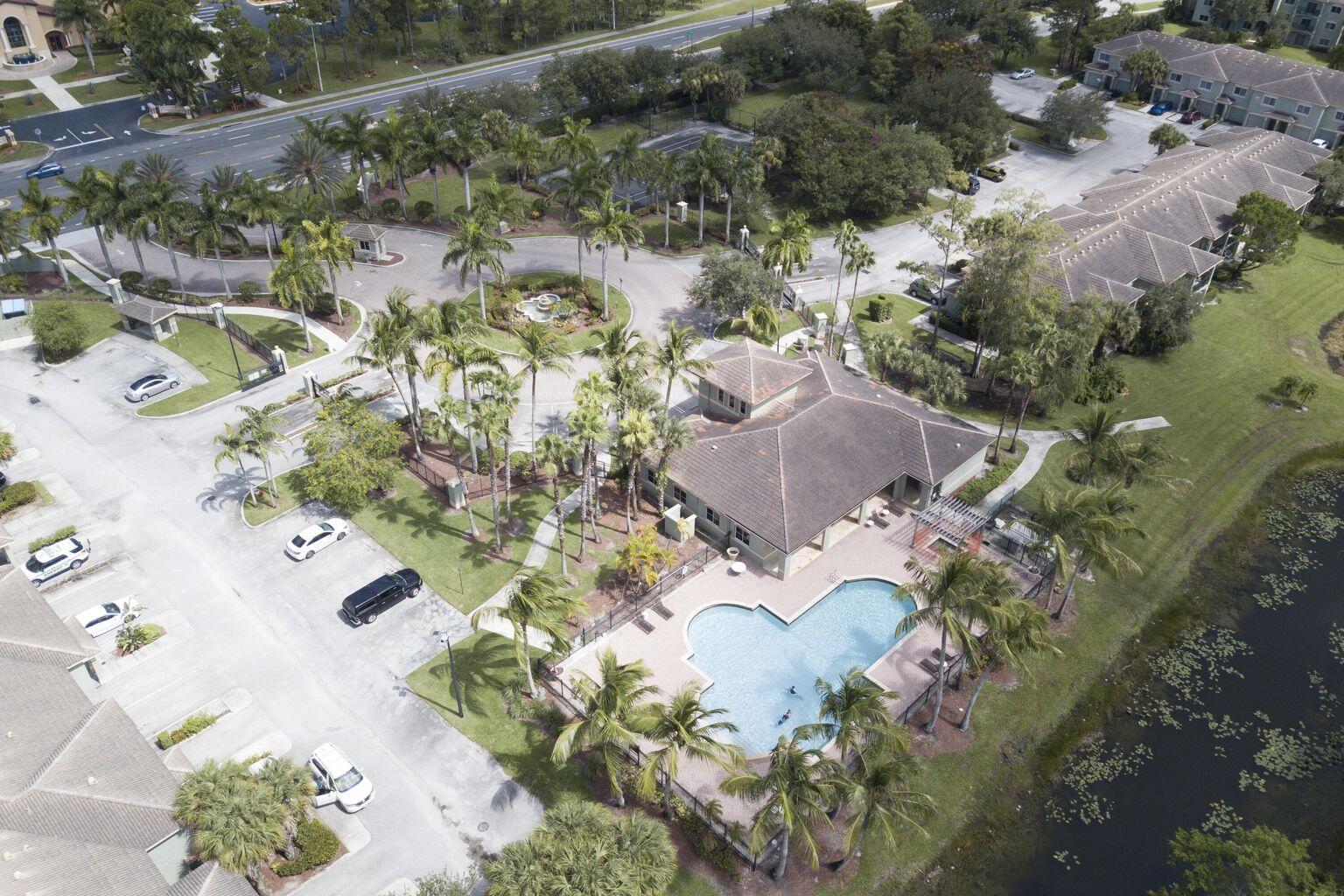 340 Crestwood Circle, Unit 201 Royal Palm Beach, FL 33411 - Photo 41 of 41 an aerial view of a house with a yard