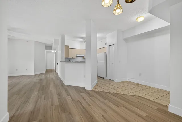 a view of a kitchen cabinets and wooden floor