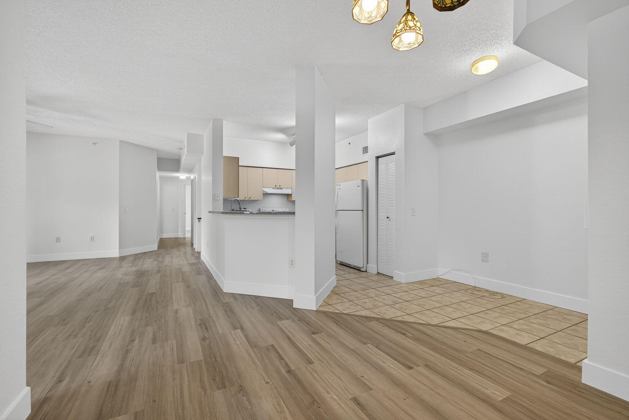 340 Crestwood Circle, Unit 201 Royal Palm Beach, FL 33411 - Photo 7 of 41 a view of a kitchen cabinets and wooden floor