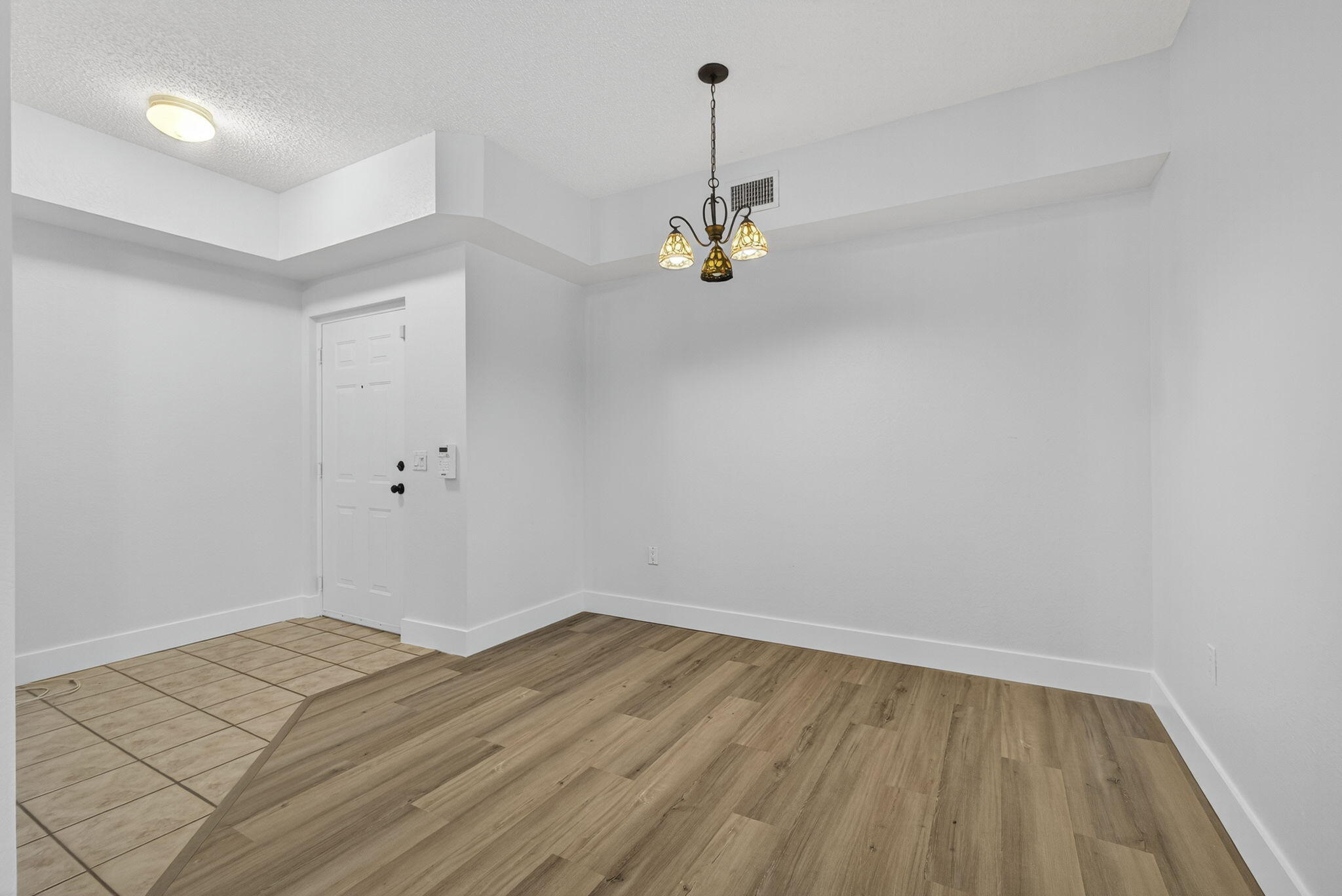 340 Crestwood Circle, Unit 201 Royal Palm Beach, FL 33411 - Photo 9 of 41 a view of empty room with wooden floor