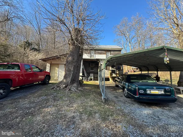 a view of a car park in front of house