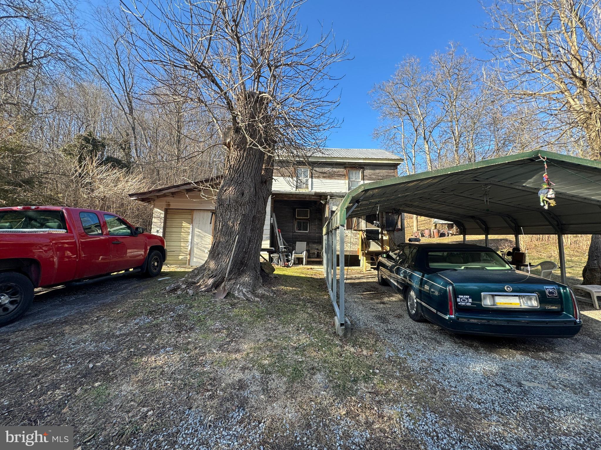 212 Benton Road East Freedom, PA 16637 - Photo 1 of 8 a view of a car park in front of house