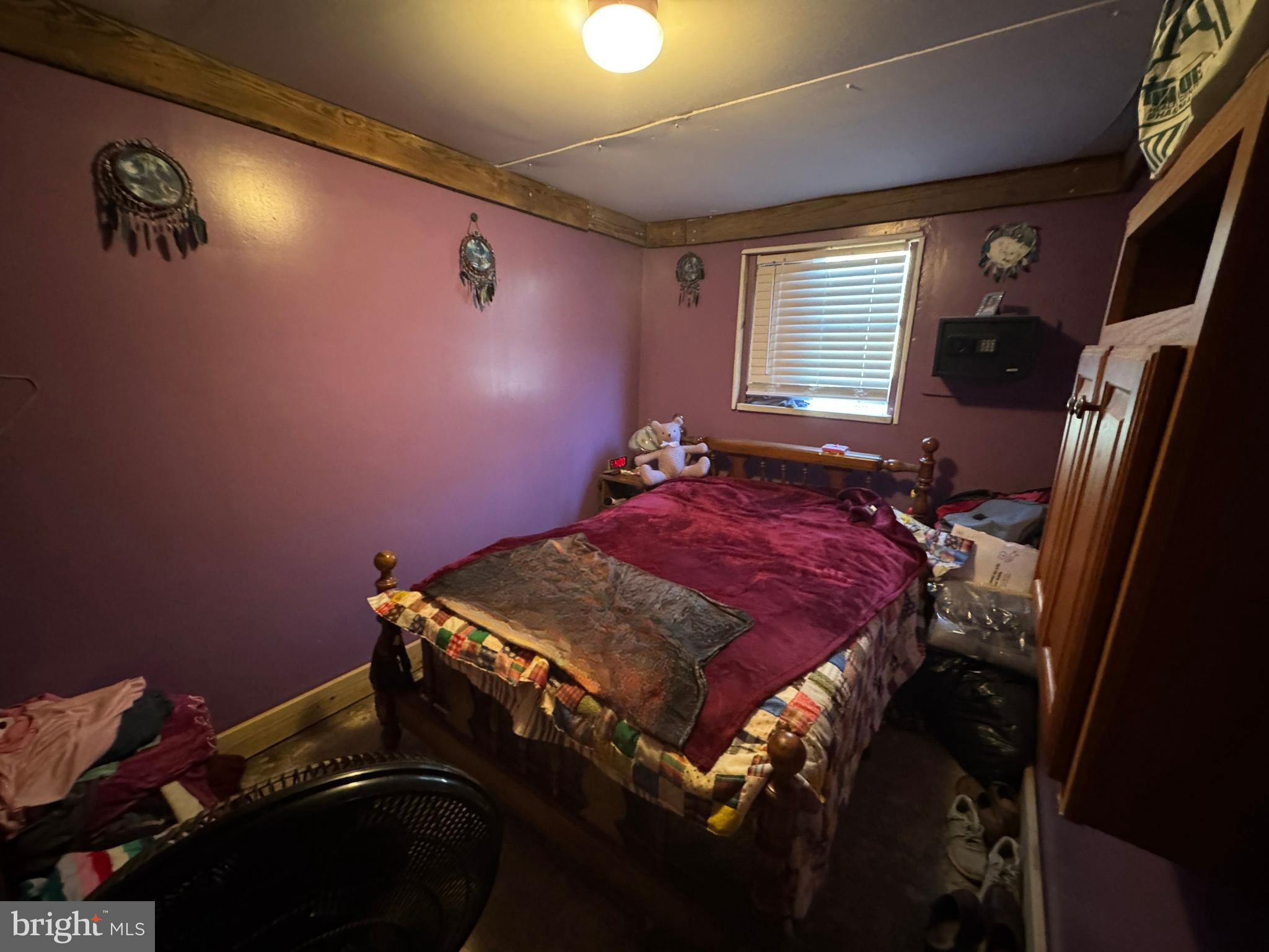 212 Benton Road East Freedom, PA 16637 - Photo 5 of 8 a bedroom with a bed and a window