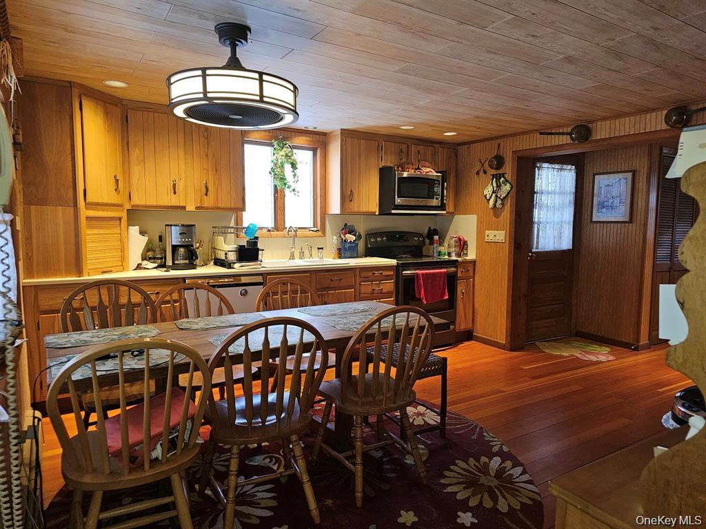107 Eldred-Yulan Road Eldred, NY 12732 - Photo 16 of 24 a view of a dining room with furniture window and wooden floor