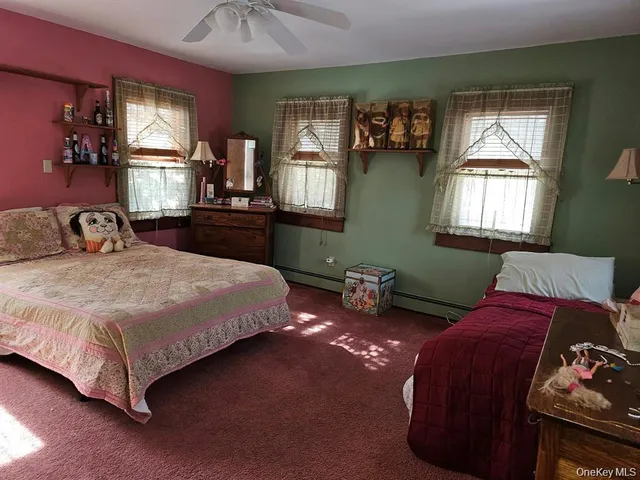 a bedroom with a bed window and furniture