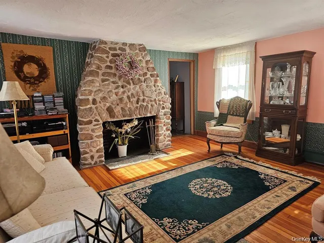 a living room with furniture rug and window