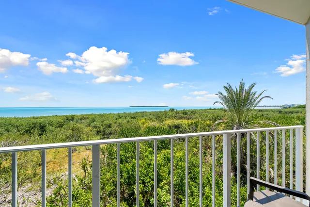 a view of a balcony with an ocean view