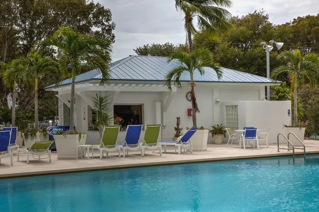 a view of a house with backyard porch and kitchen
